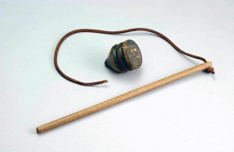 Image of a whip (small wooden pole with leather strap) and top (small wooden spinning) courtesy of Tairawhiti Museum